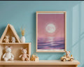 Framed Print A4 Classic Black - Whimsical princess moon scene with soft pink ethereal sky and rippling purple waves