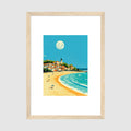 Framed Coastal Town Beach Poster A2 Classic Wood Frame - Charming seaside village art print with golden beach, white-capped waves, blue sky background, and luminous moon above quaint architecture