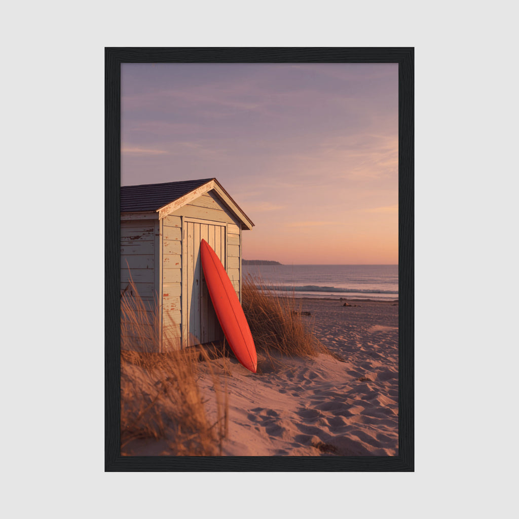 Framed Poster A4 Classic Black - Red surfboard leaning against weathered beach hut with golden sunset sky and ocean in background