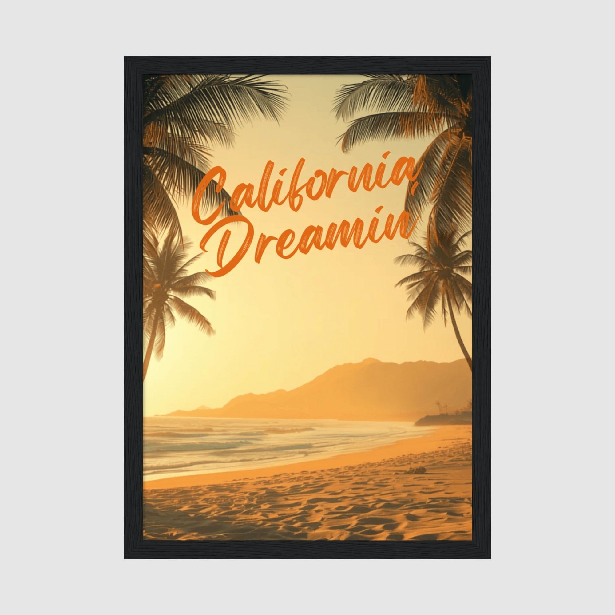 Framed Poster A4 Classic Black Frame - Warm golden sunset beach scene with palm trees framing the composition and orange script text reading California Dreaming