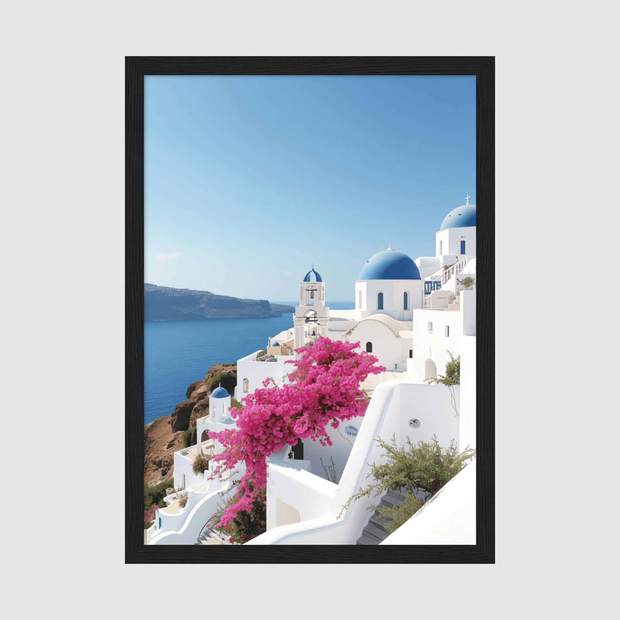 Framed Poster A4 Black Frame - Iconic white Santorini buildings with blue domed roofs overlooking turquoise Mediterranean Sea with vibrant pink bougainvillea flowers in foreground