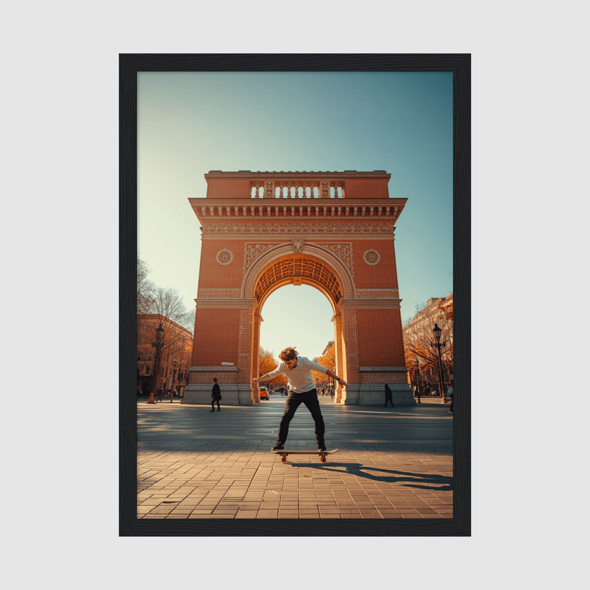 Framed Poster A4 Classic Black Frame - Skateboarder performing trick in front of red brick Arc de Triomf with golden sunlit archway and blue sky