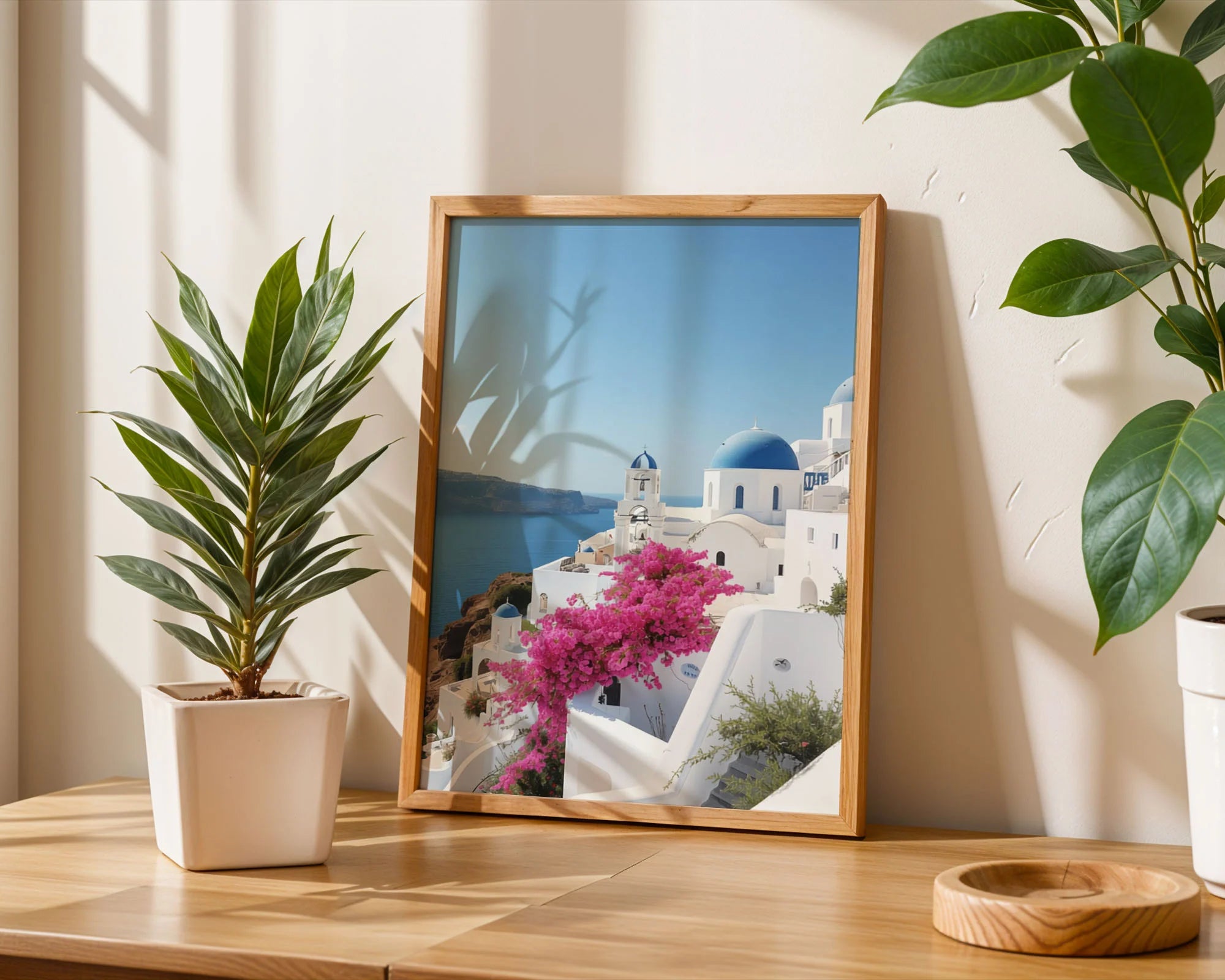 Framed Poster A2 White Frame - Full Santorini scenic vista featuring iconic white architecture, bright blue domes, pink flowering vines, and crystal clear Mediterranean waters